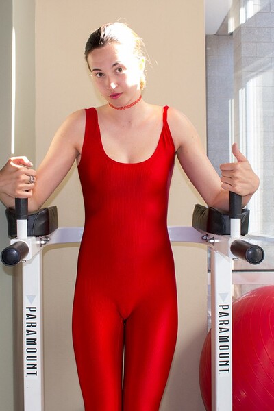 Portia Kincaid pulls down her tight spandex suit to show her small breasts