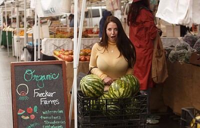 Curvy brunette wraps her large breasts around a pole in public
