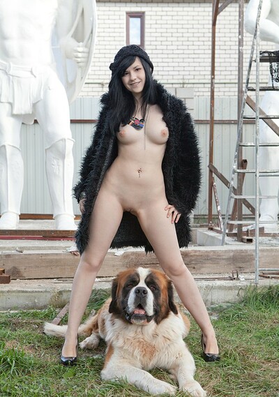Newbie Ultima models outdoors with her dog revealing her juicy tits and tight pussy