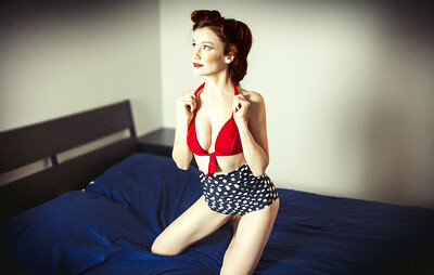 A flirty and playful Emily Bloom dazzles us with her sexines as she poses in the pin up outfit