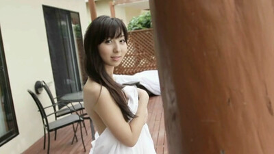 Flirty and playful model Riho Iida strips flirtatiously