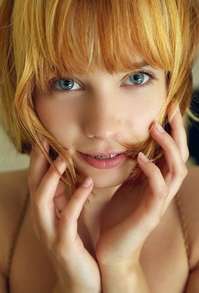 Gorgeous redhead cutie Lily poses naked and teases with her clear blue eyes