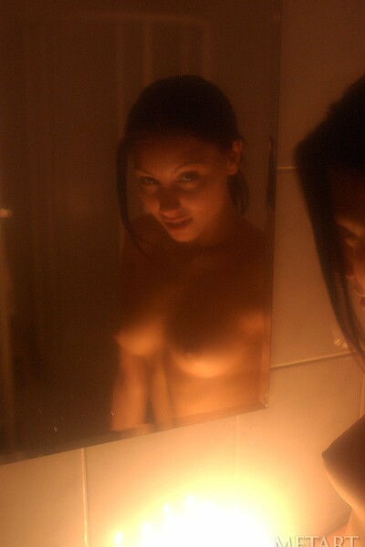 Sensual brunette diva showing off her figure in the bath