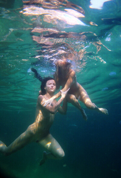 Magnetic brunette Kseniya B swimming in the ocean naked
