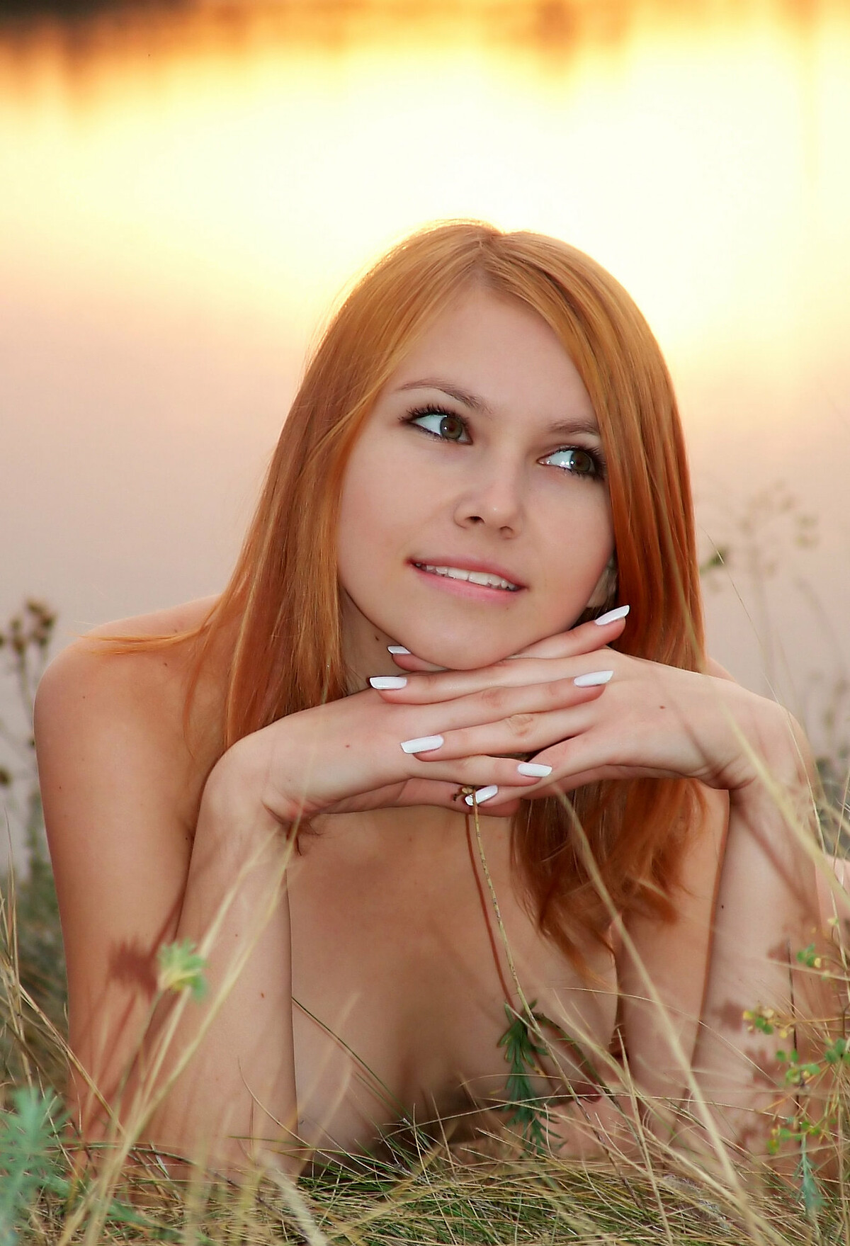 Sweet redhead Lidiya A connecting her naked body with nature