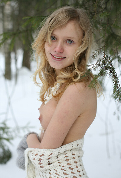 Winter goddess runs naked around the snowy woods