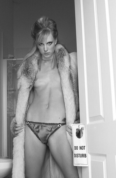 Flat-chested diva using a fur coat to cover her assets