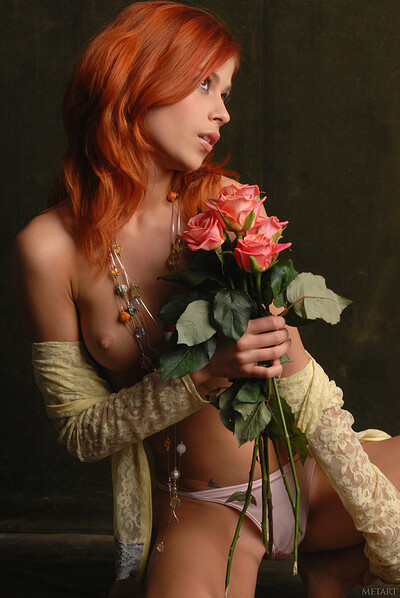 Romantic redhead hottie caressing her naked body with roses