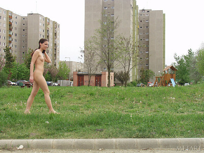 Magnetic brunette treating her neighbors with a naked daily stroll