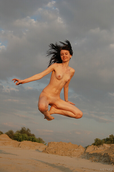 Brunette girl Katya walking around in a desert being naked