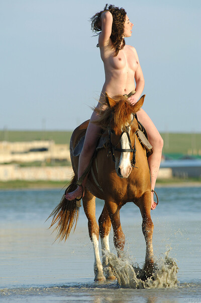 Devilish angel enjoying horse-back riding fully nude and hot
