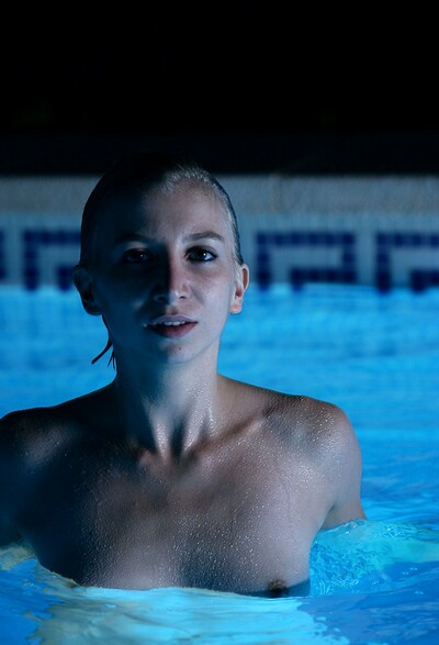 Swimming naked in a public pool gets Holly very aroused  