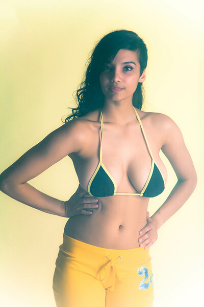 Shanaya alluringly poses and shows off her hot oiled up body and big round knockers to the camera
