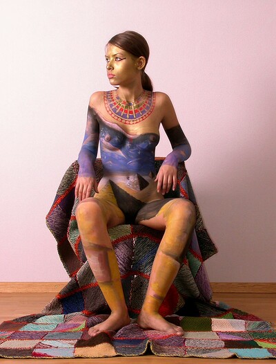 After painting her naked body young Irina posed for the camera