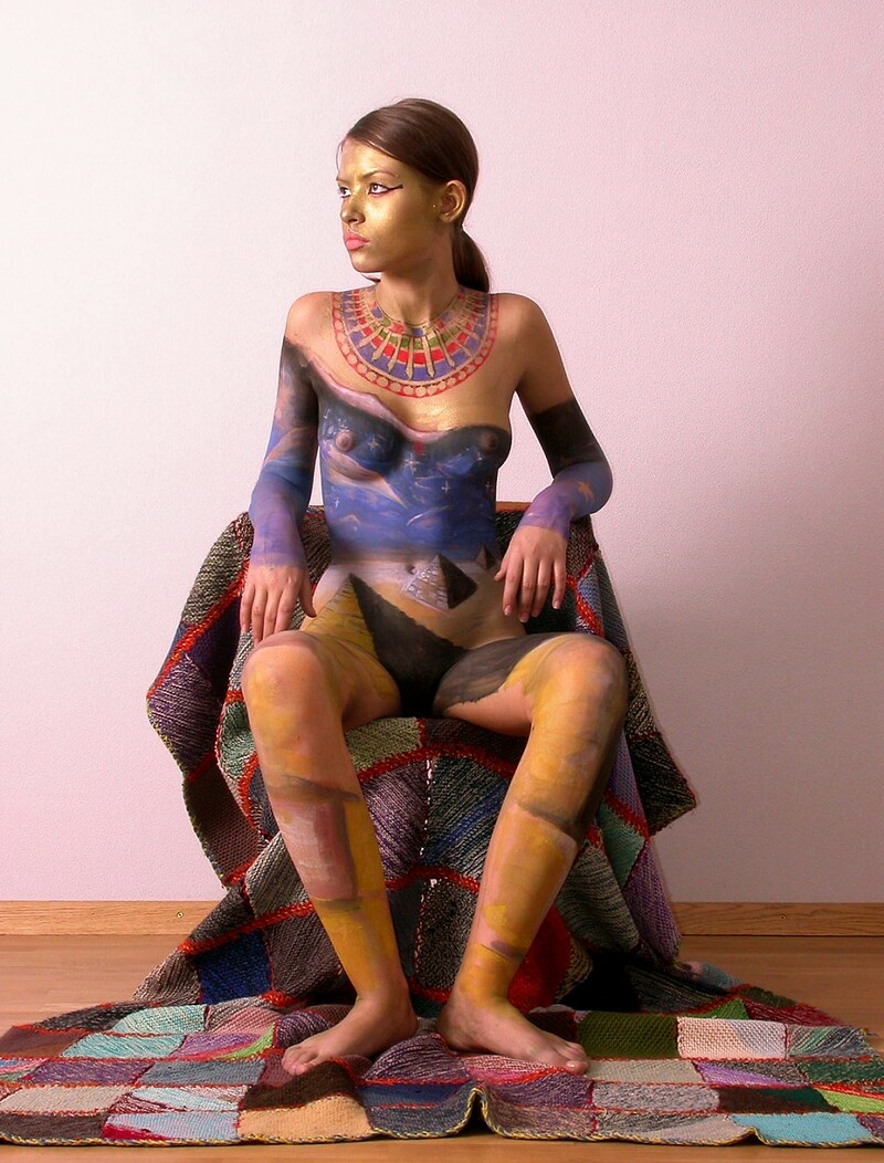 After painting her naked body young Irina posed for the camera