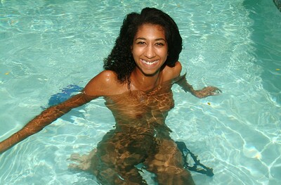 Lush ebony beauty Penelope enjoys a swimming pool naked and horny