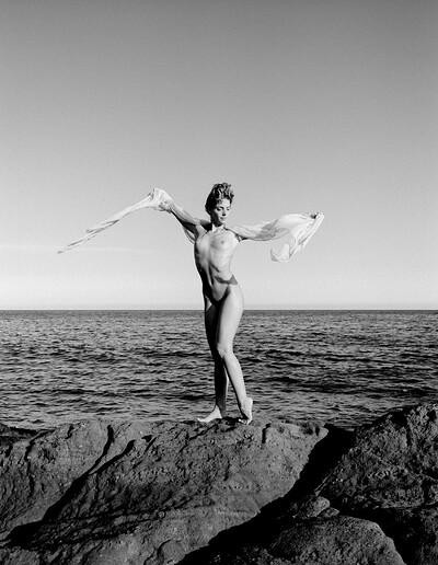 Saskia goes into the rocky outdoors to reveal her soft, immaculate figure
