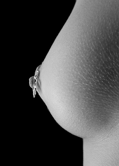 Her shiny piercing makes her small perky tits stand out