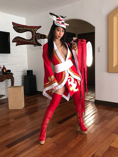 Jade Kush displaying her naughty side and attributes as she poses dressed as Akali from League of Legends