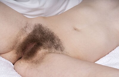 Ivy Addams in Ivy Addams is playful as she gets naked in bed from We Are Hairy