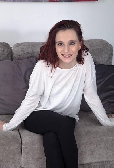 Lily May in Lily May strips naked on her grey sofa today from We Are Hairy
