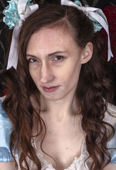 Mercy Quinn in Mercy Quinn plays in her blue doll dress from We Are Hairy