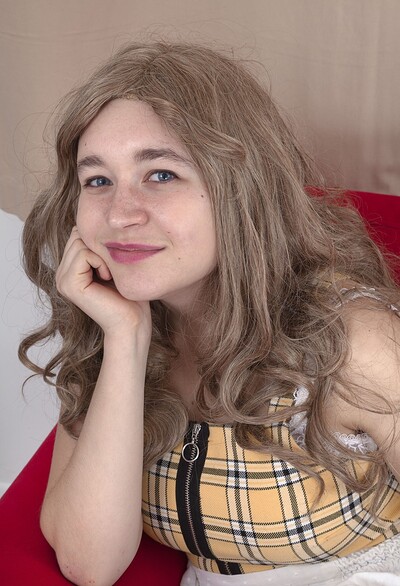 Dolores Maria in Dolores Maria strips naked on her red armchair from We Are Hairy