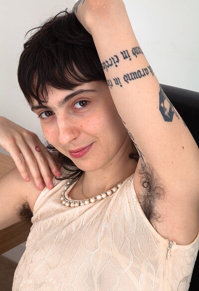 Frida in Frida strips naked on her leather chair from We Are Hairy