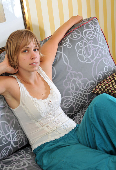 April in April frolicks with her hairy pussy on the couch from We Are Hairy