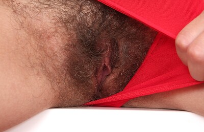 Marcia in Sexy Marcia pulls on her sweaty pussy hair from We Are Hairy