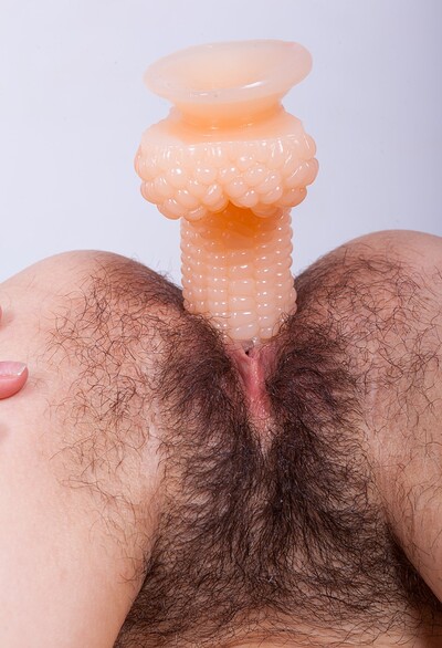 Eva in Eva Lisana slides off her pink skirt to masturbate from We Are Hairy