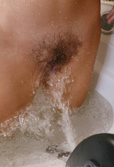 Elena V in Natural milf Elena V sprays water on her clit from We Are Hairy