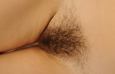 Julia S in Natural Julia S masturbates on the bed from We Are Hairy