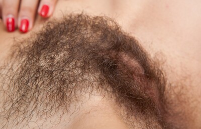 Kristina in We Are Hairy set Kristina pulls on her hairy pussy lips