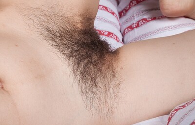 Di Devi in Di Devi masturbates after waking up in bed from We Are Hairy