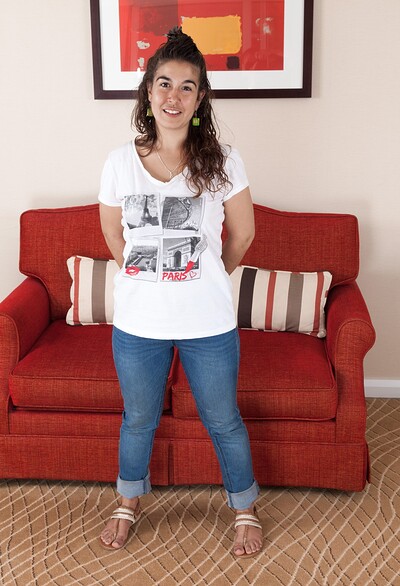  in Lisandra strips naked on her red sofa from We Are Hairy