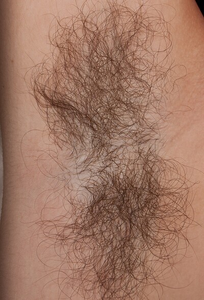 Simone Delilah in Hairy Simone spreads wide open on a chair from We Are Hairy