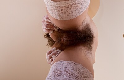 Gretta in Young hairy cutie Gretta plays with her stockings from We Are Hairy