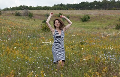 Shaya in Shaya masturbates on her towel in the fields from We Are Hairy