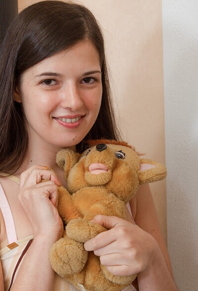 Lima in Lima strips and plays with her favorite stuffed toy from We Are Hairy