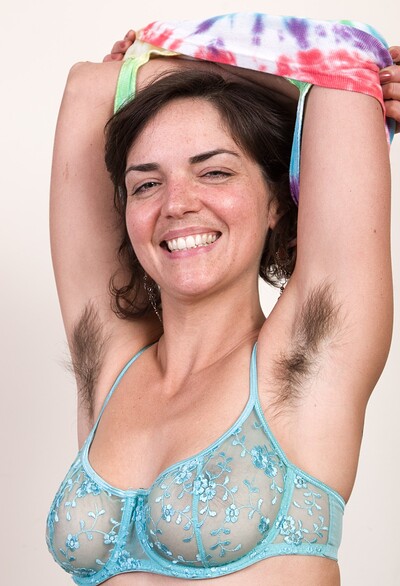 Katie Zucchini in Katie Z shows off feet and hairy body on her sofa from We Are Hairy