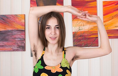 Halmia in Halmia strips naked on her chair to relax from We Are Hairy