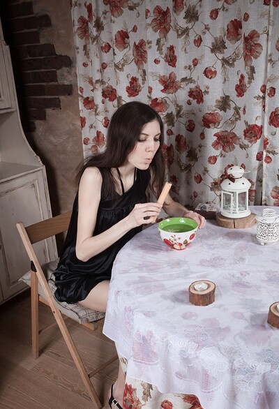 Maia in Maia strips naked on her table with a candle from We Are Hairy