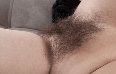 Dominique in Dominique strips naked while enjoying a tulip from We Are Hairy