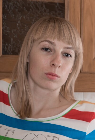 Natinella in Natinella strips naked on her kitchen counter from We Are Hairy