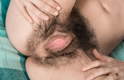 Luna O in Luna O strips naked on her blue bed from We Are Hairy