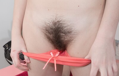 Kira Tomson in Kira Tomson strips and masturbates on her table from We Are Hairy