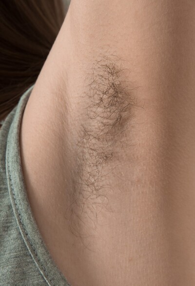 Amelia in Amelia strips naked by her couch from We Are Hairy