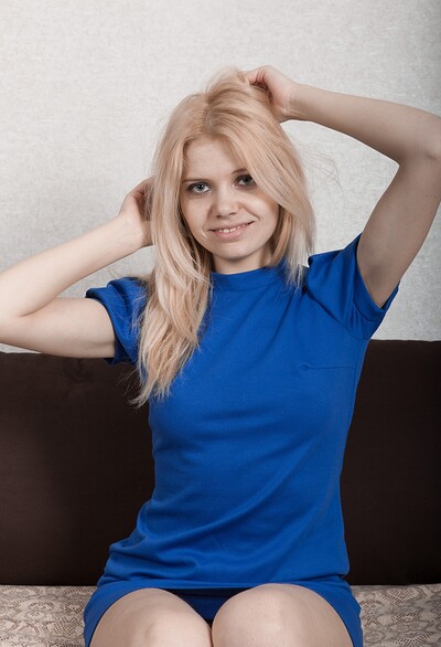 Amuza in Amuza strips off blue dress to pose naked on bed from We Are Hairy