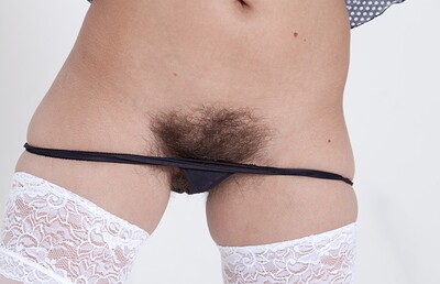 Dominique in Dominique strips naked while in white stockings from We Are Hairy